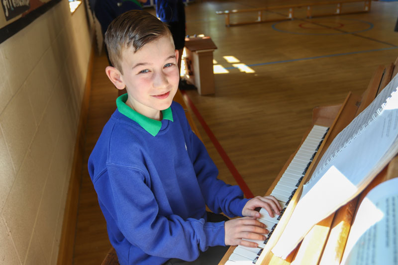 Child playing musical instrument